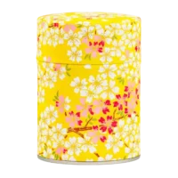 Photo de la boîte à thé classique - ajonc : papier washi jaune vif décoré de petites fleurs blanches et de feuilles rouges. Boîte ronde.
