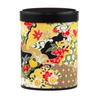 Photo de la boîte à thé empilable - Erable du Japon : papier washi tons jaune et noir, feuilles d'érable, fleurs, style japonais. Boîte ronde, couvercle noir.