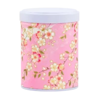 Photo de la boîte à thé empilable - Fleurs de cerisier : papier washi branches de cerisier et petites fleurs blanches, fond rose pâle. Boîte ronde, couvercle blanc.