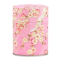 Photo de la boîte à thé classique - Fleurs de cerisier : papier washi branches de cerisier et petites fleurs blanches, fond rose pâle. Boîte ronde.