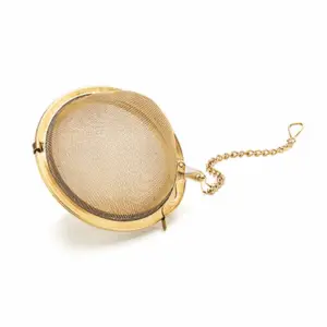 Boule à thé - Dorée : Boule à thé dorée, ficelle en inox et petit crochet pour la coincer sur la tasse.