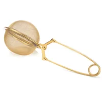 Cuillère à thé - Dorée : Cuillère à thé dorée en inox. Système de pince suffisamment longue pour des tasses hautes.